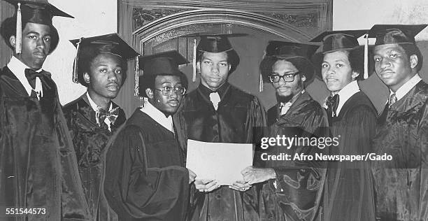 Graduates, the most successful students, men and women in academic dress at the graduation ceremony for City College, Baltimore, Baltimore, Maryland,...