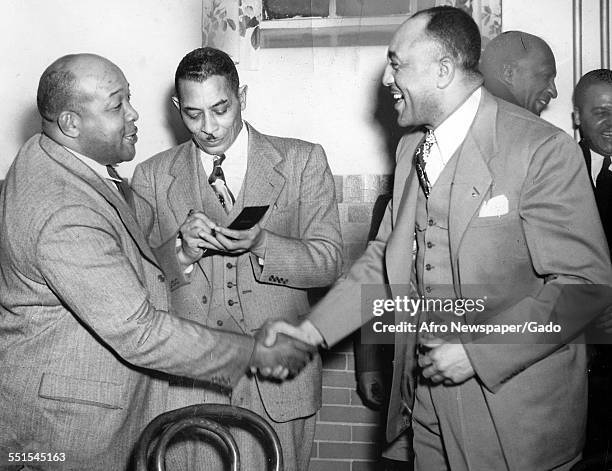 Two men greeting each other at the African-American Baltimore college, Baltimore, Maryland, January 2, 1948.