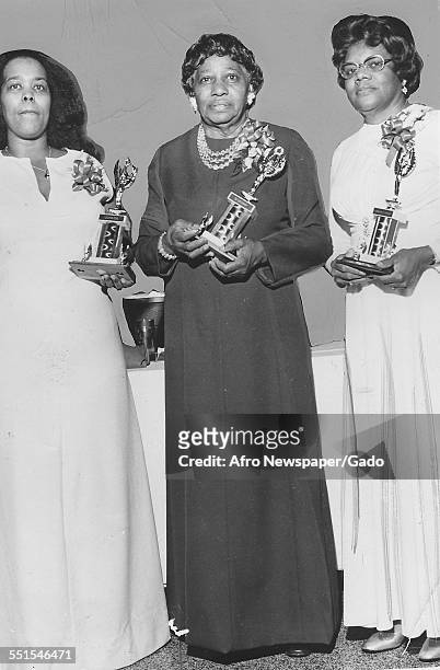 Three women, Award winners of a finer womanhood mention, sponsored by the Alpha Phi Zeta chapter of Zet Phi Beta sorority in 1975 in Richmond,...
