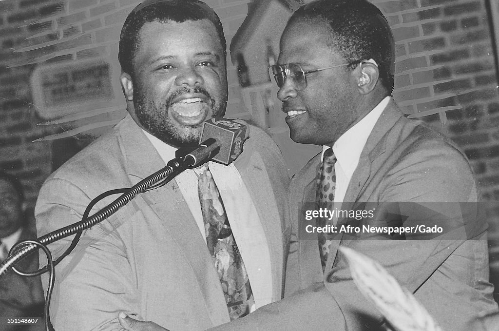 Two men at a microphone, Larry Young, state senator and delegate in ...