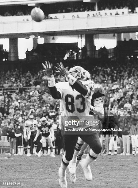 The Washington Redskins and the Dallas Cowboys American football teams in a game, with Ricky Saunders, wide receiver, catching a pass for a score,...