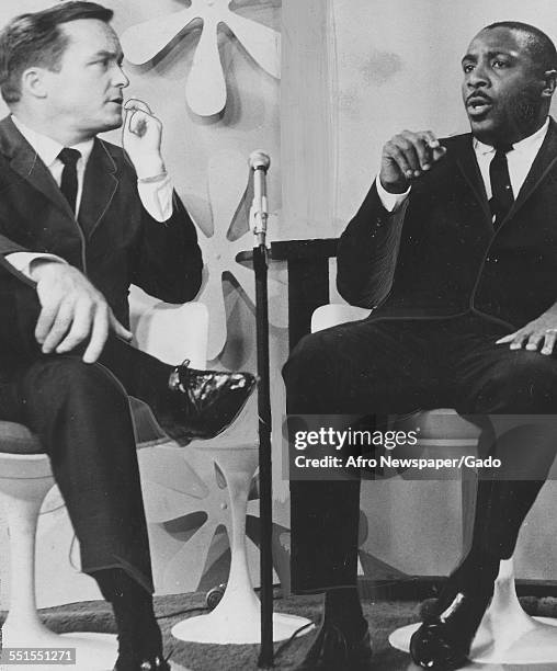 Dick Gregory, comedian and civil rights campaigner answering Mike Douglas questions on a television talk show, January 23, 1965.