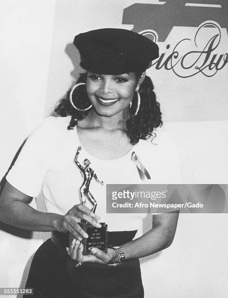 American singer Janet Jackson with her Sammy Davis, Jr. Entertainer of the Year Award at the Sixth Annual Soul Train Music Awards, held at Shrine...