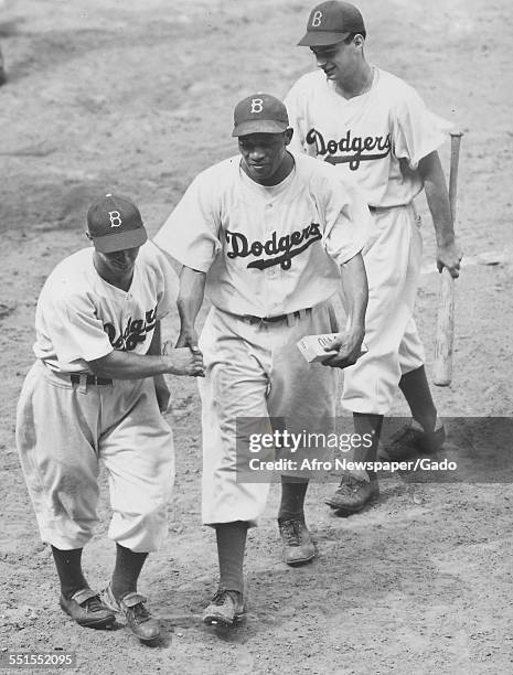 Dan Bankhead, Brooklyn Dodgers pitcher, with his team after scoring a home run on his debut, New York City, New York, August 30, 1947.