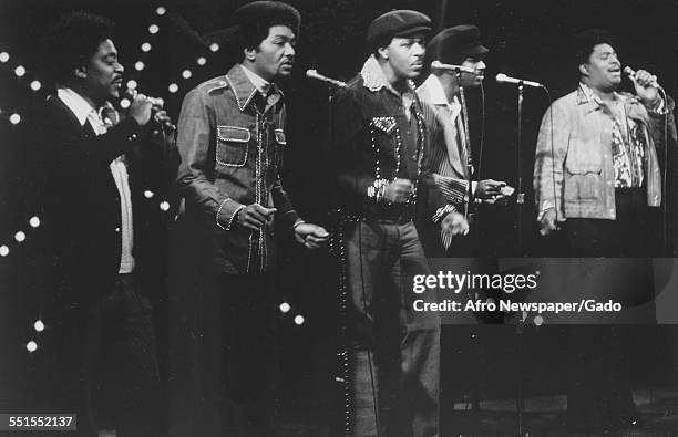 The Dells, an American R&B vocal group, five men performing on stage, 1960.