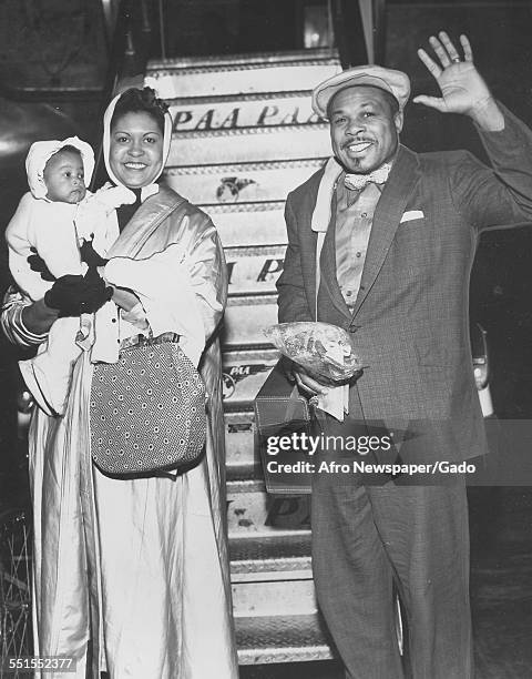 Archie Moore, African-American professional boxer and the Light Heavyweight World Champion, with his wife and a child, 1946.