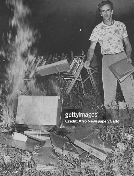 Hitlerism Comes Back to Life in New York State, headline with an image of a man throwing books onto the flames of a fire, and burning books at a...