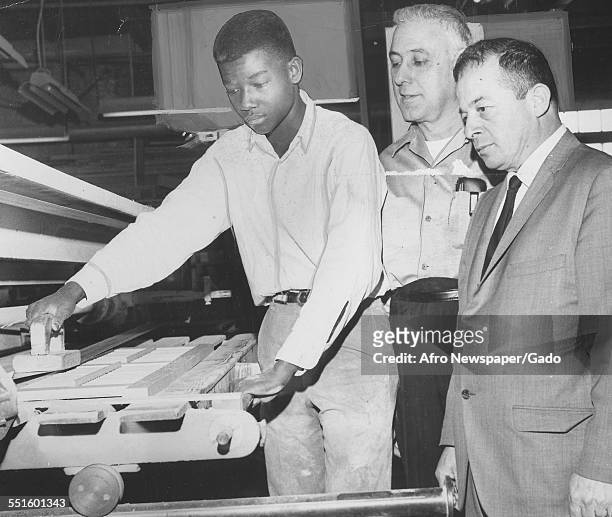 Trainees enrolling for work, a young man with two mature men at a wood factory, enrolling for work under the anti-poverty campaign in Newark New...