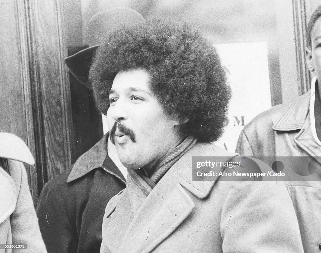 A Man With An Afro And Moustache