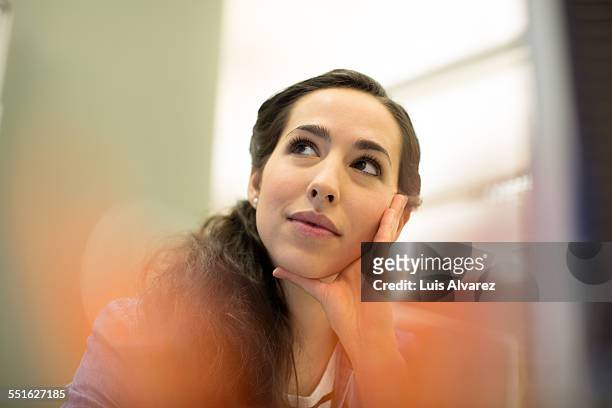 thoughtful businesswoman in office - candid stock pictures, royalty-free photos & images