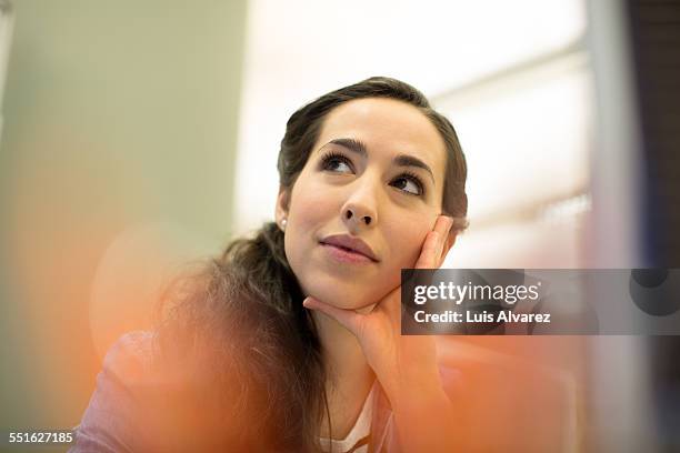 thoughtful businesswoman in office - portrait and selective focus stock pictures, royalty-free photos & images