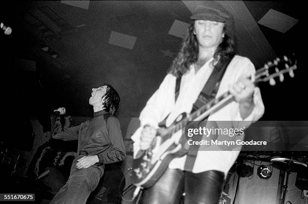 Bobby Gillespie and Robet 'Throb' Young of Primal Scream perform on stage at Barrowlands, Glasgow, Scotland, United Kingdom, October 1991.