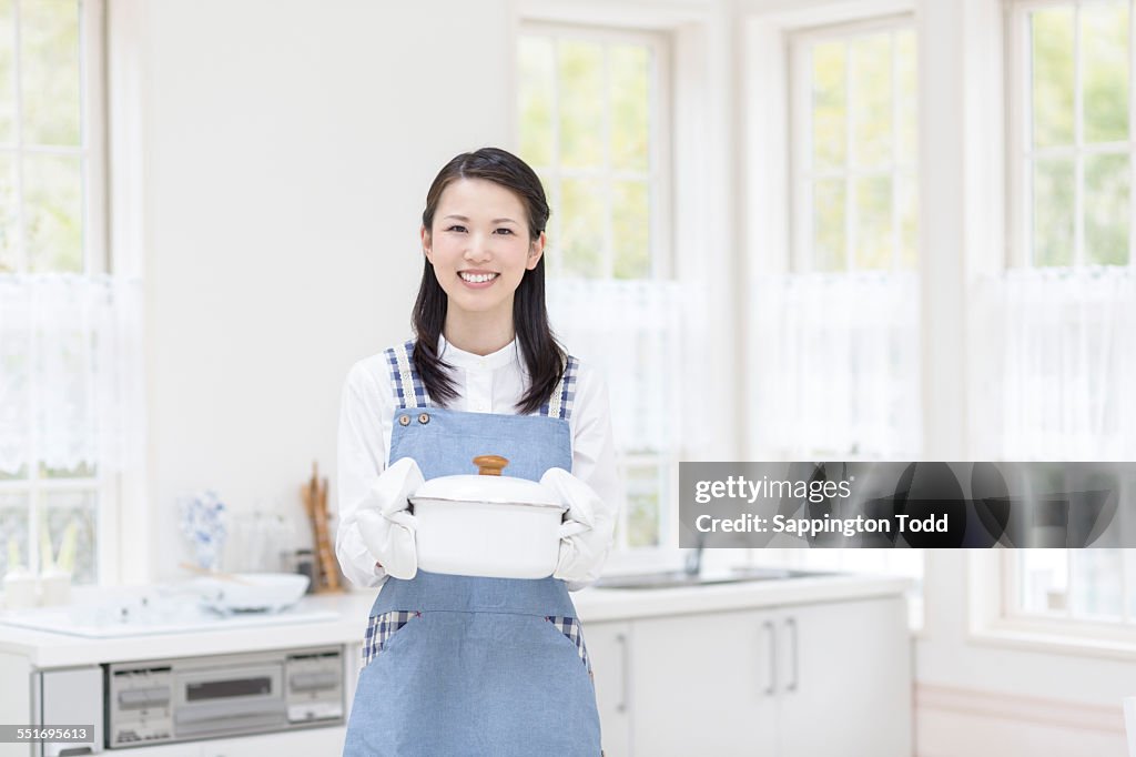 Woman Holding Cooking Pot