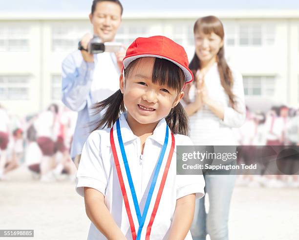 close-up of girl wearing medals - cas awards stock pictures, royalty-free photos & images