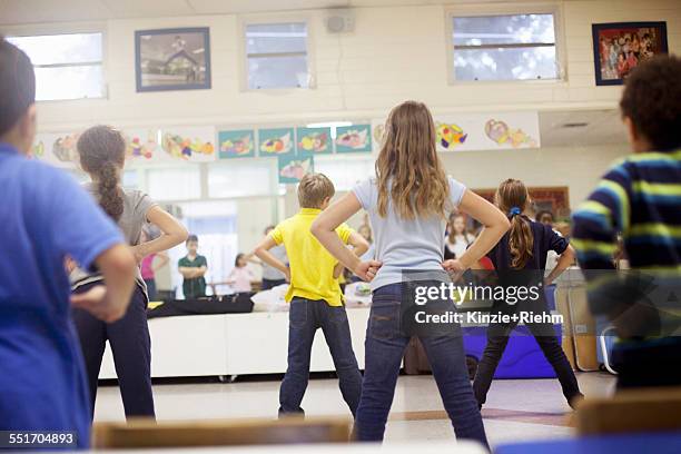 children dancing in classroom - boys wearing tights stock-fotos und bilder