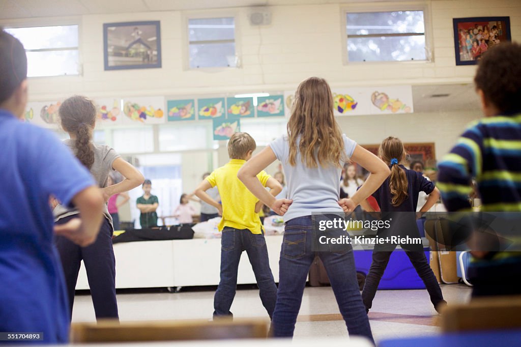 Children dancing in classroom