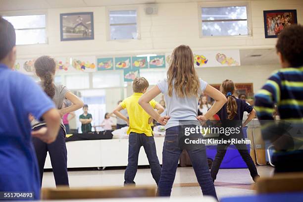 children dancing in classroom - dancing classrooms stock pictures, royalty-free photos & images