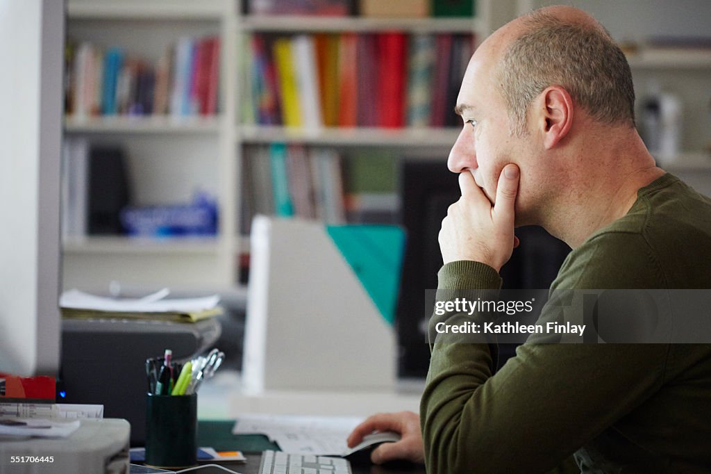 Mature man working in creative studio