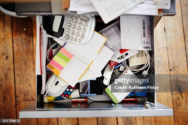 desk drawer full of stationery - schublade stock-fotos und bilder