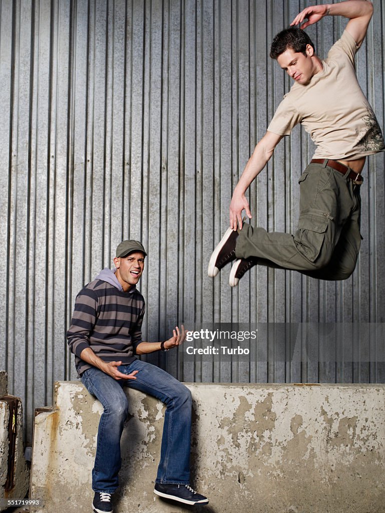 Men Jumping and Playing Air Guitar
