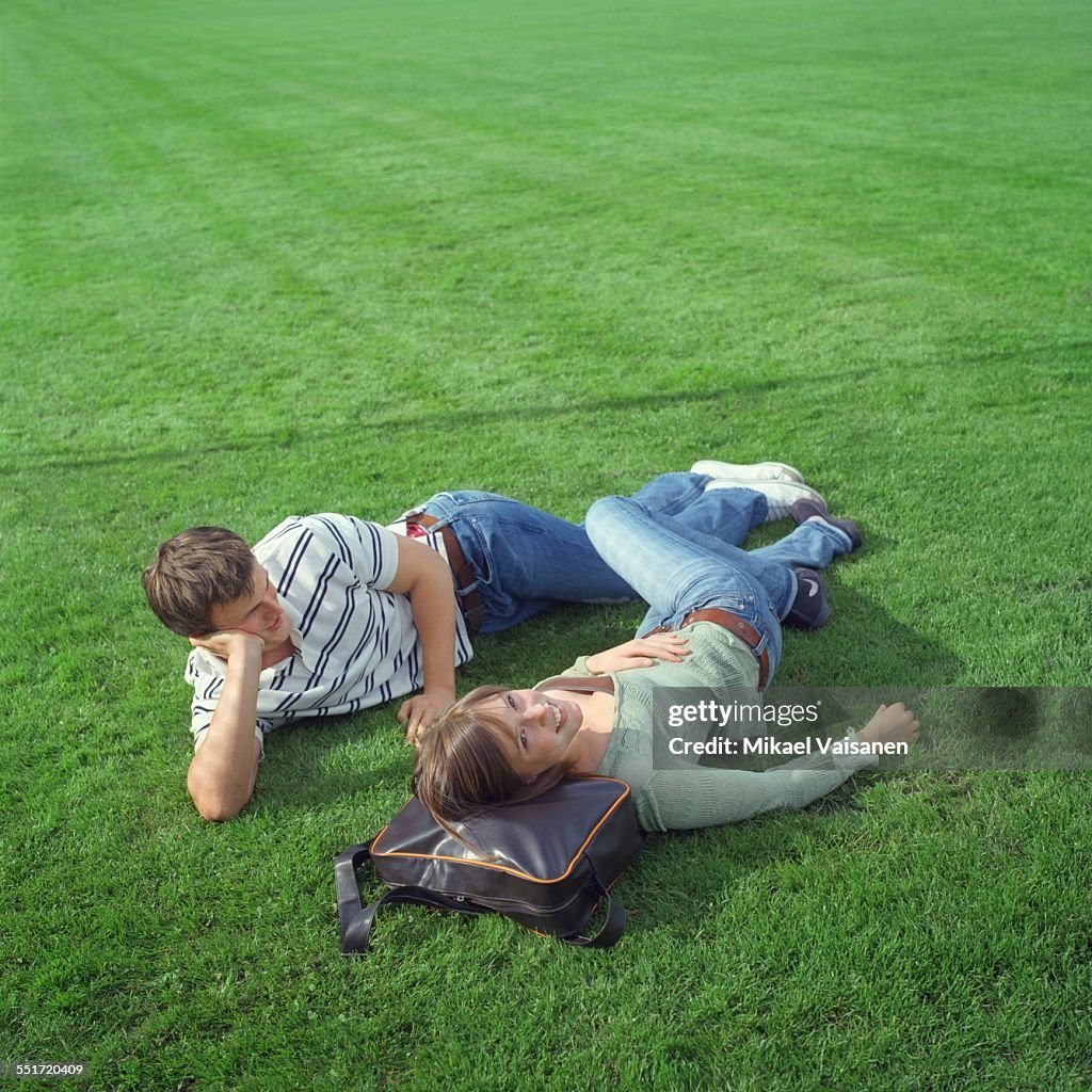 Couple Lying on Field