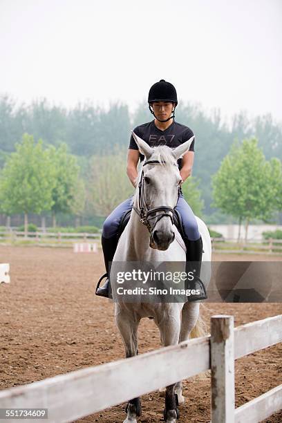 young man riding a horse - 馬の衣装 ストックフォトと画像