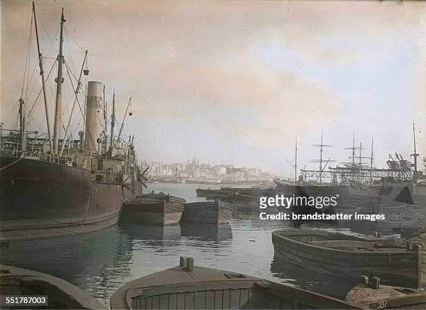 Marseille. France. View from the port to the city. In the background Notre-Dame de la Garde. About 1930. Handcolored lantern slide.