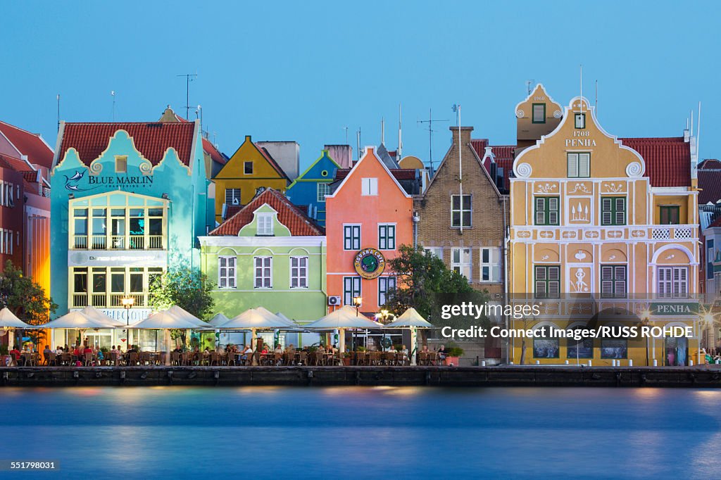 Traditional multi colored town houses on waterfront at dusk, Punda, Willemstad, Curacao, Caribbean