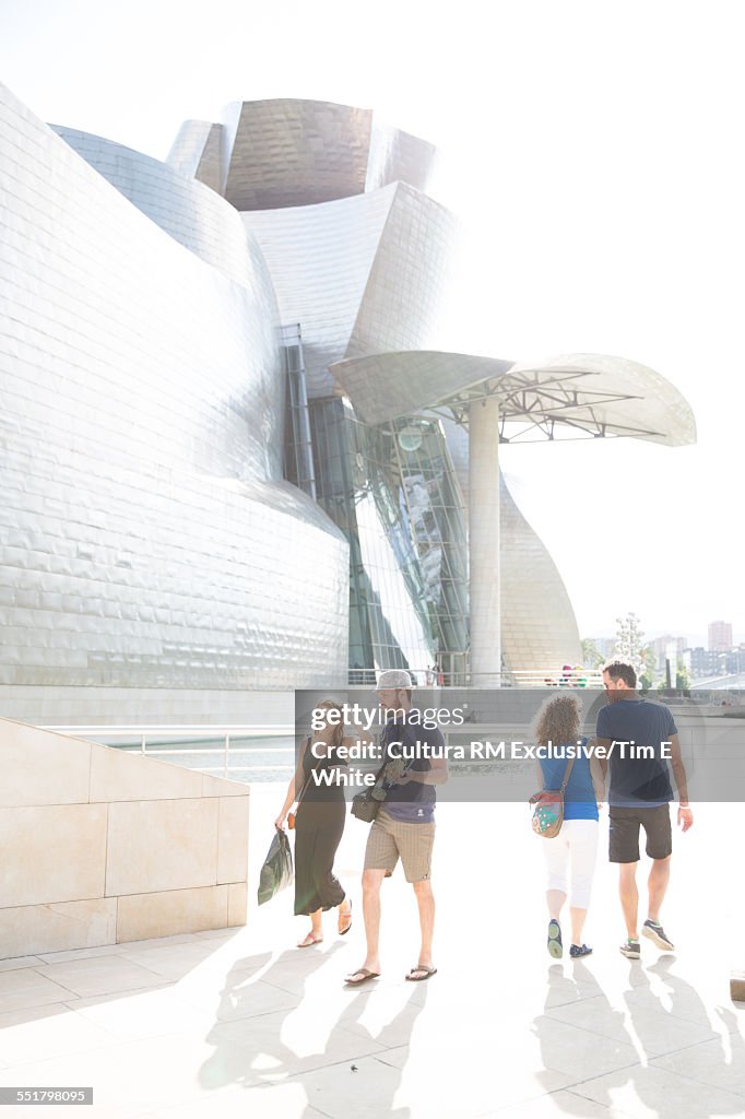 Tourists strolling around Guggenheim museum, Bilbao, Spain