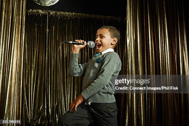 Boy Sim Singer 1,572 Boy Singing On Microphone Stock Photos, High-Res Pictures, and ...
