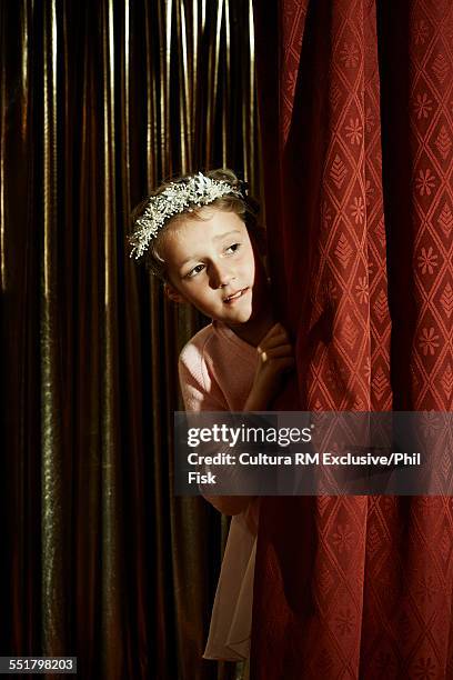 girl with head wreath behind stage curtain - recita della scuola foto e immagini stock