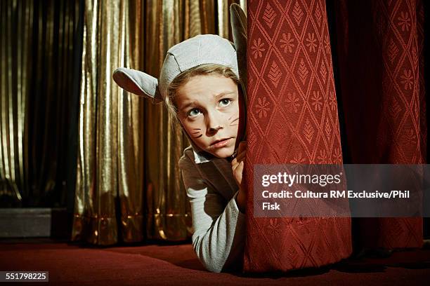 girl in mouse costume behind stage curtain - behind the curtain stock pictures, royalty-free photos & images