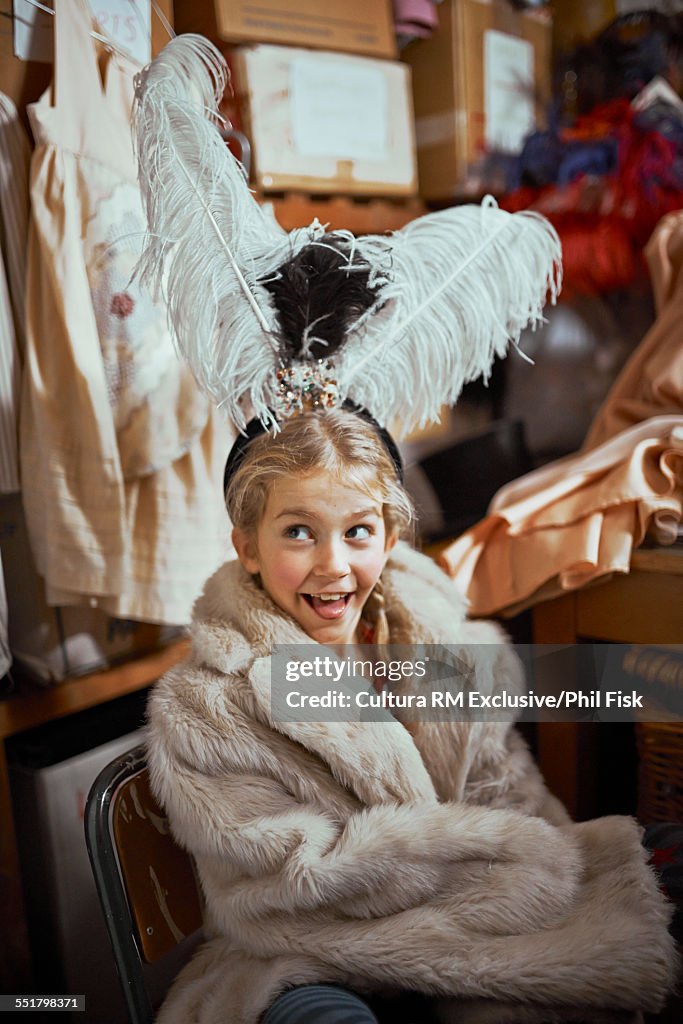 Girl wearing fur coat theatre costume backstage