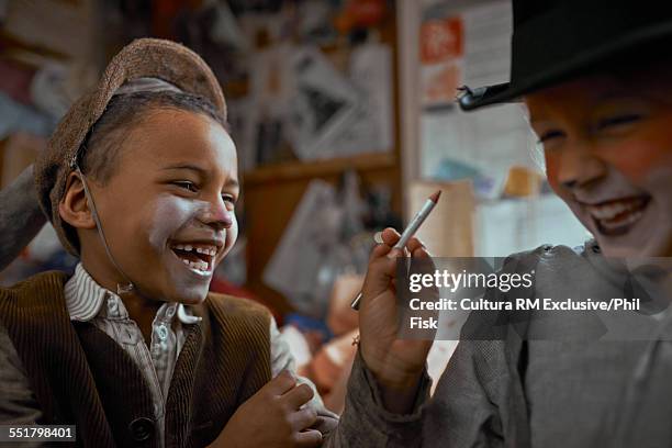 girl and boy playing with theatre make up backstage - rm creatief stockfoto's en -beelden