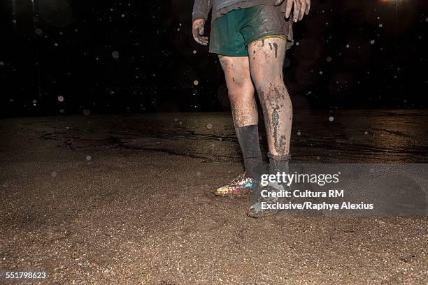 muddy legs and shoes of rugby player on field - dirty sock stock pictures, royalty-free photos & images