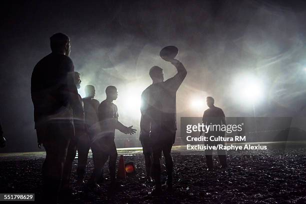 line out, overhead pass on muddy field - rugby sport foto e immagini stock