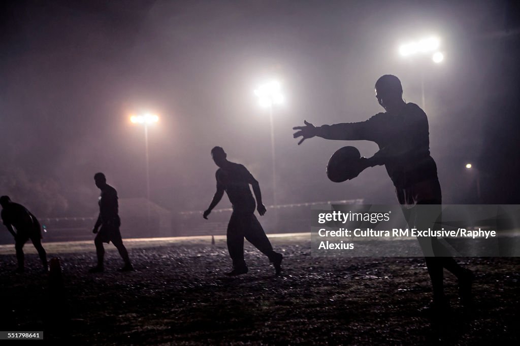 Rugby drop kick on muddy field