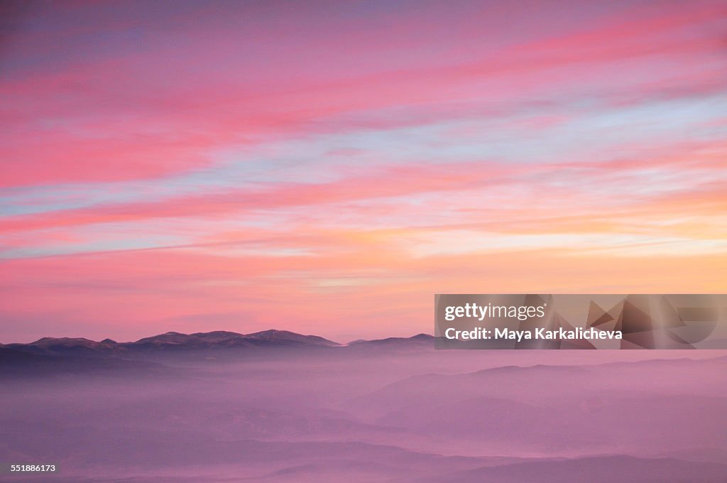 Aereal view of pink sunrise in a mountain