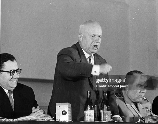 Russian politician and Premier Nikita Krushchev stands and shakes his fist during his farewell press conference, Paris, France, May 18, 1960. With...