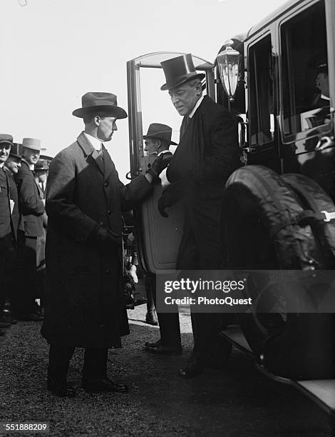 American politician and US President Woodrow Wilson steps down from an automobile, Washington DC, mid to late 1910s.