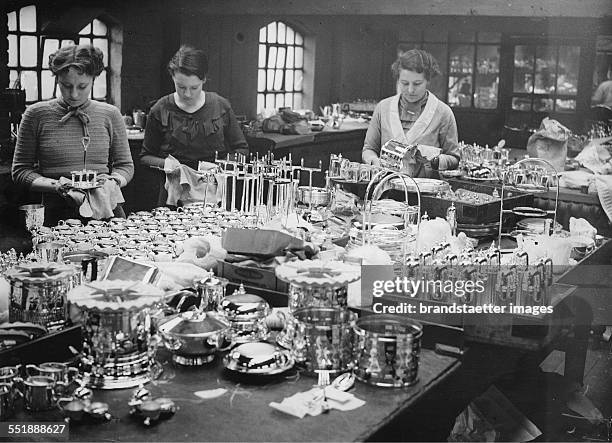 Part of silver plate of the silversmiths of the company Elkington for the ship QUEEN MARY. Birmingham. 11th March 1936. Photograph.