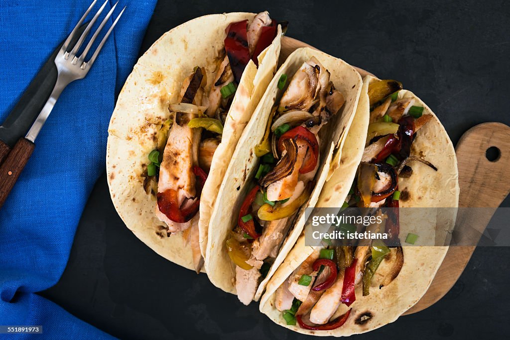 Chicken fajitas served  on a flour tortilla