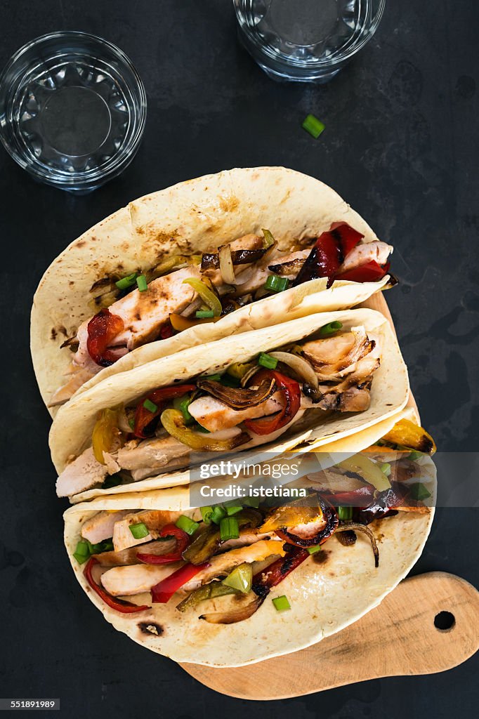 Chicken fajitas served  on a flour tortilla