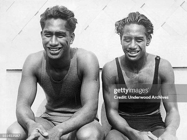 Hawaiian swimming stars Duke Kahanamoku and his younger brother Sam at a break during the tryouts at the Olympic Pool in Long Beach for the 1924...