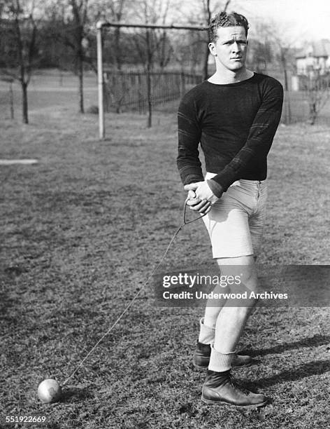 Princeton University star hammer thrower WA Moore prepares for spring practice, Princeton, New Jersey, March 17, 1927.