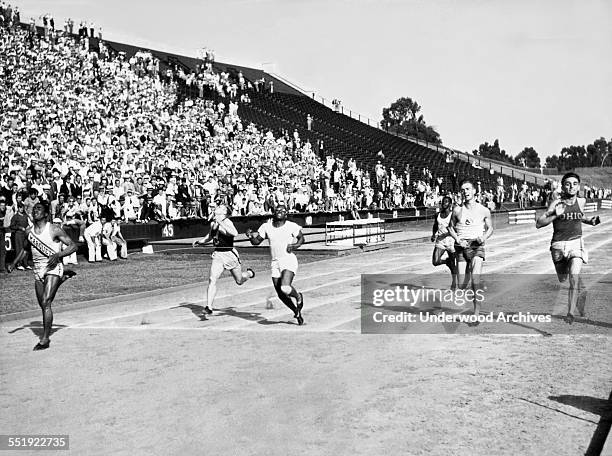 The final American tryouts for the 1932 Olympics 200 meter dash at Stanford Stadium, Stanford, California, July 16, 1932. L-R: Ralph Metcalfe,...
