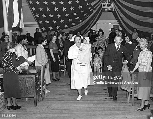 Part of a fashion parade at the largest WPA sewing shop in NY where 3,000 women produce clothing and linens to be distributed among the unemployed,...