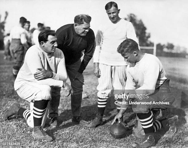 Glenn 'Pop' Warner is the new football coach at Stanford University, Stanford, California, November 1924. L-R: 'Tiny' Thornhill, linesmen tutor; Pop...