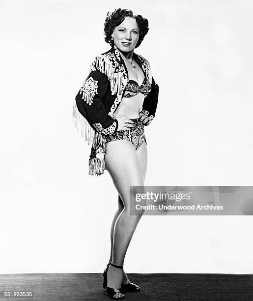 Studio portrait of professional woman wrestler and current world champion, June Byers, Boston, Massachusetts, circa 1953.