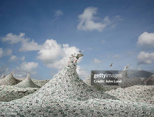 financial abundance in a sea of money - capitalismo foto e immagini stock